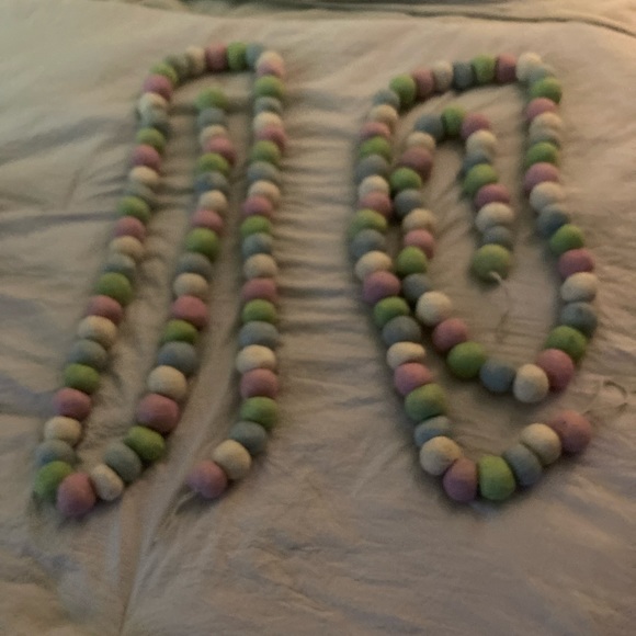 2 strings of pastel wool balls.  Excellent for a large glass bowl in a nursery. - Picture 2 of 2